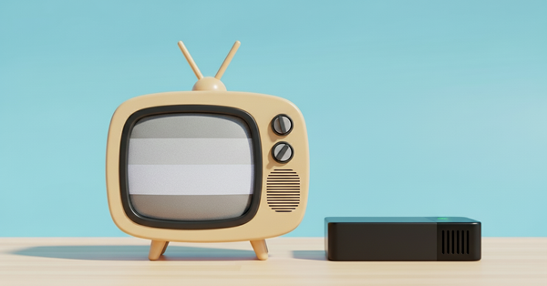 케이블 tv와 셋톱박스가 책상위에 놓여져 있는 이미지